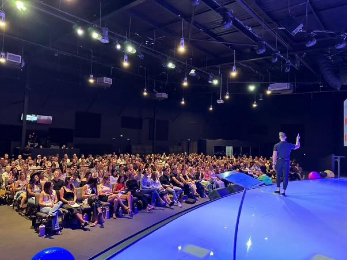 Dr Daniel Kirkbride speaking to 800+ people